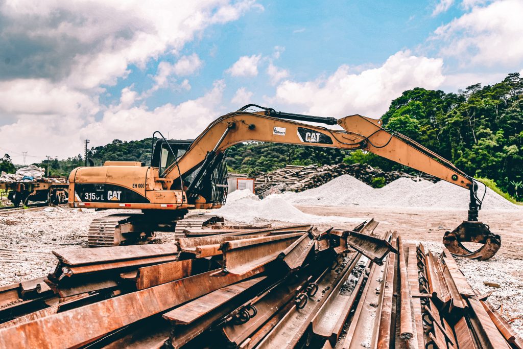 A large excavator sitting at a propane-powered construction site