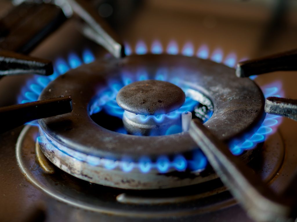 Close-up of flames on a propane-fueled stove-top burner