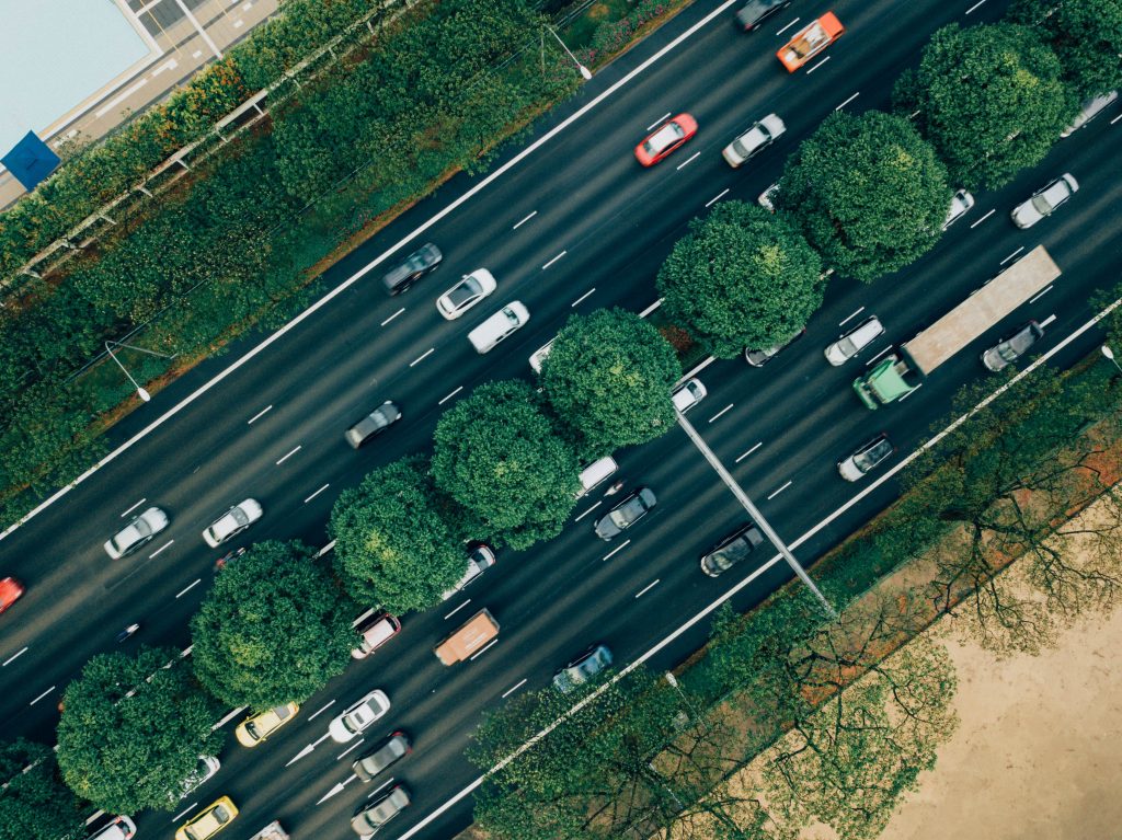 Overhead shot of a busy city street with heavy traffic.