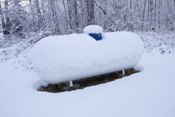 Propane tank covered in snow on a frigid winter day